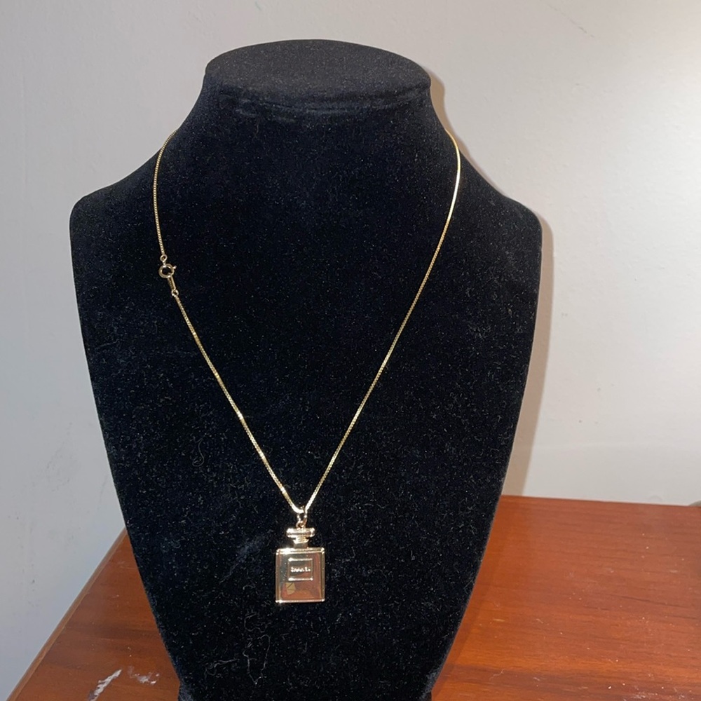 Gold plated Chanel pendant. I will include the necklace.